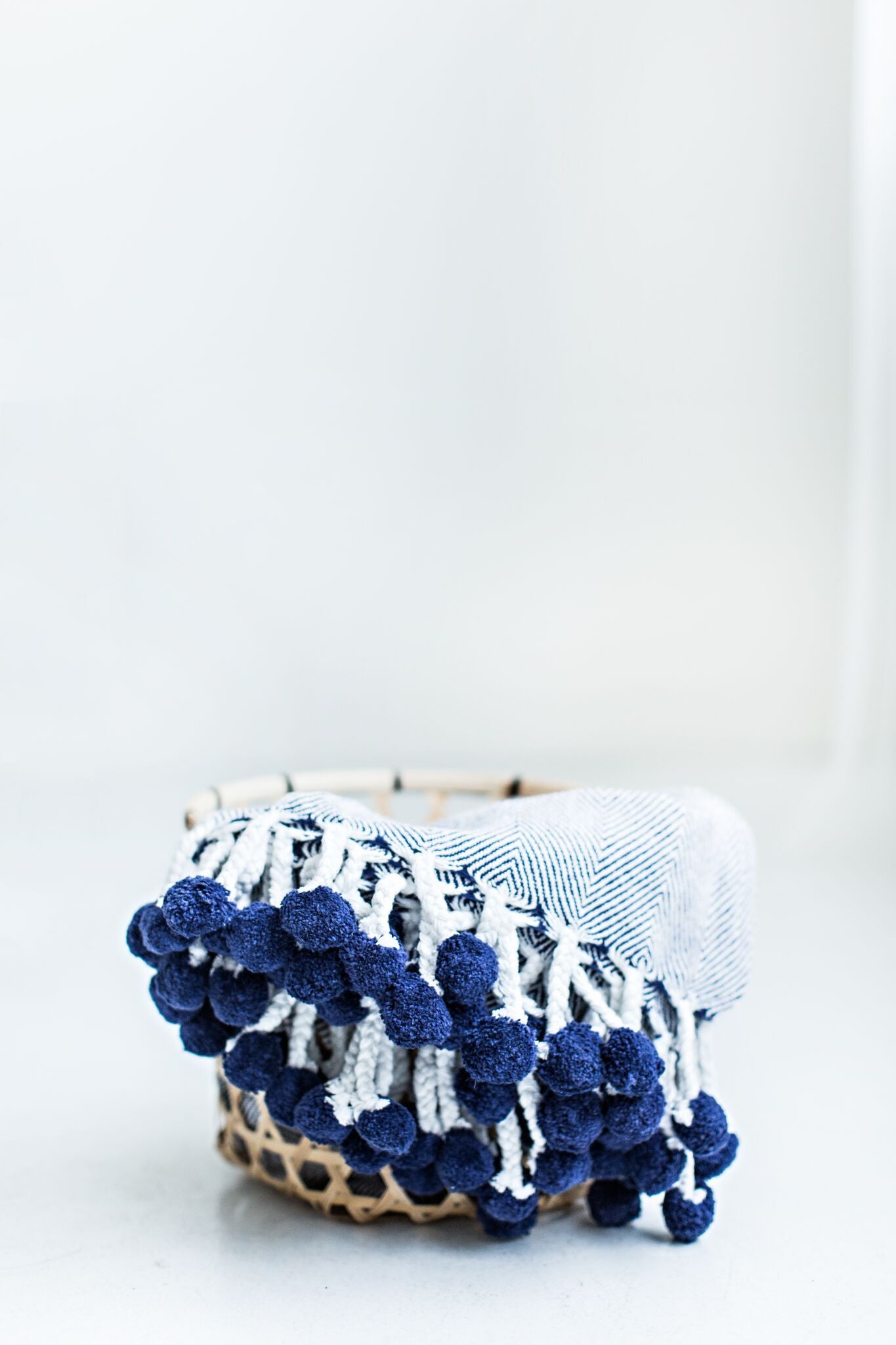 Navy pom pom blanket hotsell